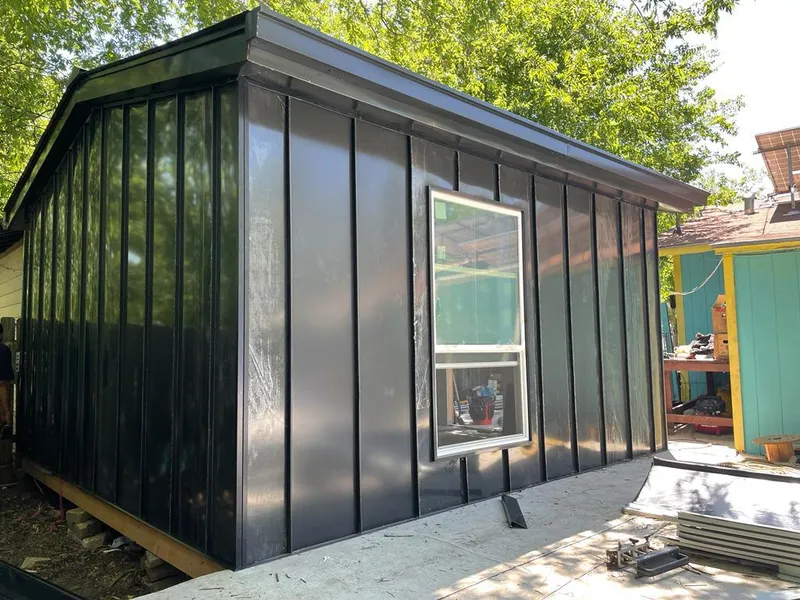 Black standing seam metal wall panels for Roof Inspection in St. Martinville