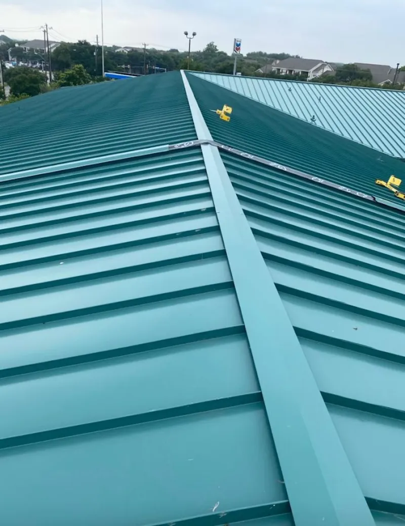 Green commercial metal roof ridge and valley for Metal Roof Repair in St. Martinville